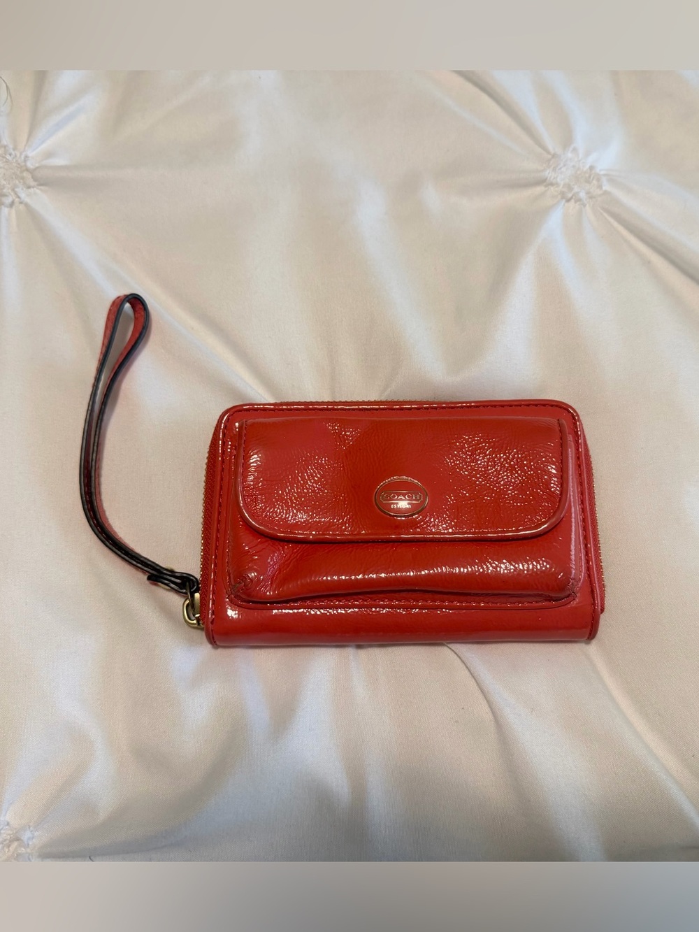 orange shiny vintage coach wristlet